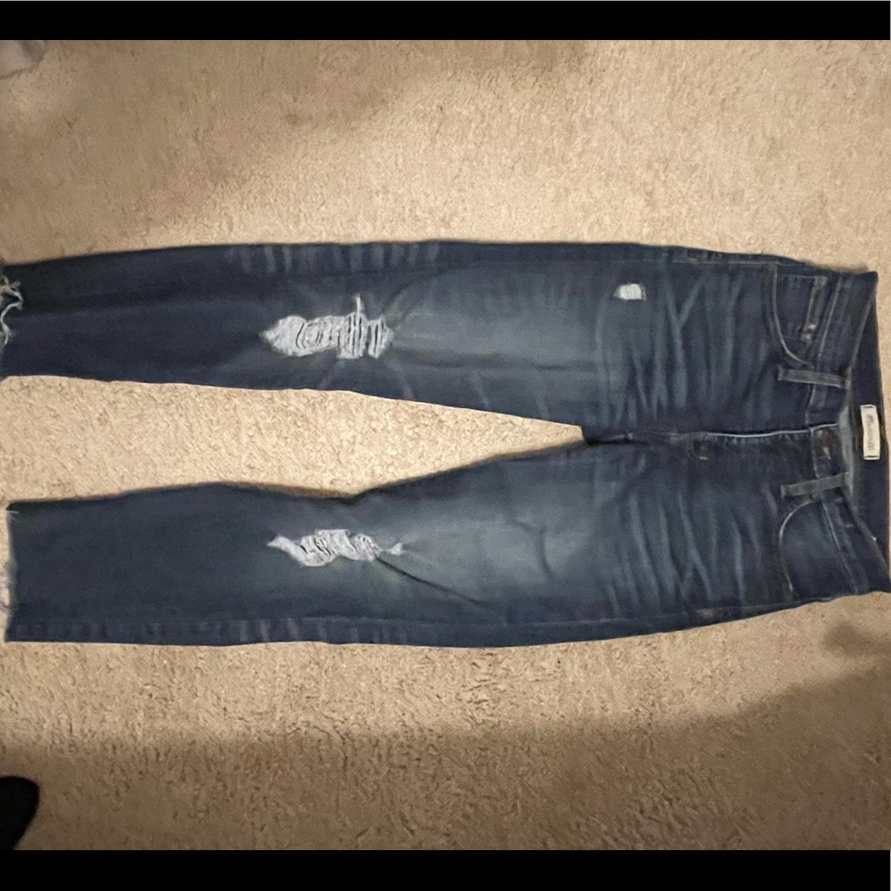 Distressed Madewell skinny jeans.